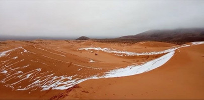 rare snowstorm blankets sahara desert in white