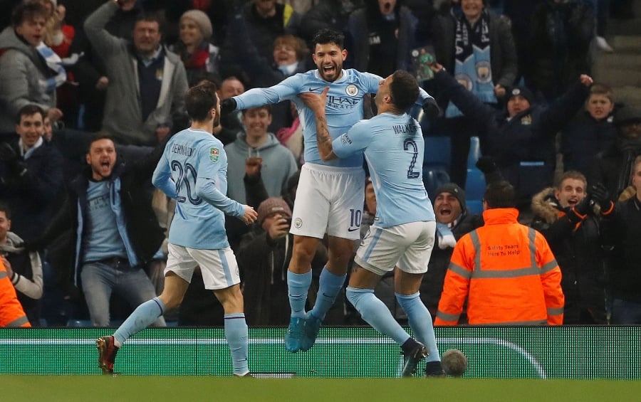 manchester city 039 s sergio aguero celebrates scoring their second goal with team mates against bristol city on january 9 2017 photo afp