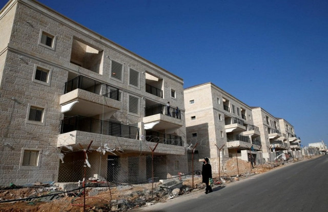 an ultra orthodox jewish man walks past buildings under construction in the israeli settlement of beitar ilit in the occupied west bank december 22 2016 photo reuters an ultra orthodox jewish man walks past buildings under construction in the israeli settlement of beitar ilit in the occupied west bank december 22 2016 photo reuters