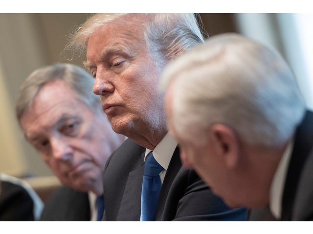 this file photo taken on january 9 2018 shows us president donald trump c and us senator dick durbin l d illinios listen as us congressman steny hoyer r d maryland speaks during a meeting with bipartisan members of the senate on immigration at the white house in washington dc photo afp