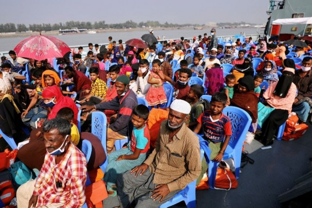 rohingyas are seen onboard a ship as they are moving to bhasan char island in chattogram bangladesh december 4 2020 reuters file rohingyas are seen onboard a ship as they are moving to bhasan char island in chattogram bangladesh december 4 2020 reuters file