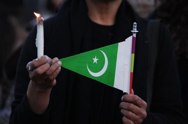 a woman holds a candle and a pakistani flag as she takes part in a protest against terrorism in islamabad photo reuters a woman holds a candle and a pakistani flag as she takes part in a protest against terrorism in islamabad photo reuters
