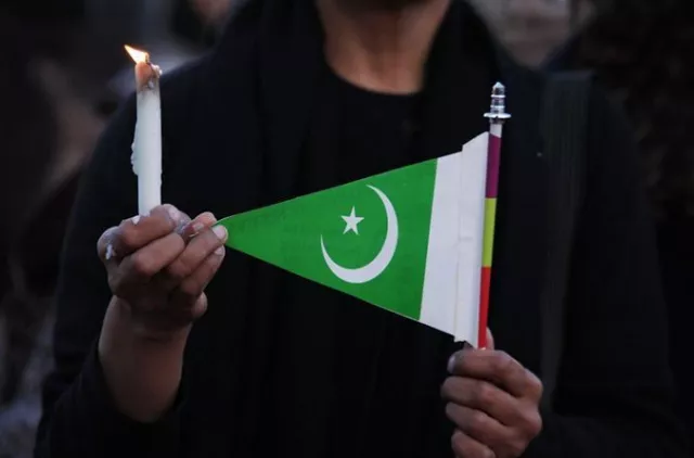 a woman holds a candle and a pakistani flag as she takes part in a protest against terrorism in islamabad photo reuters a woman holds a candle and a pakistani flag as she takes part in a protest against terrorism in islamabad photo reuters