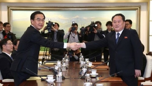 head of the north korean delegation ri son gwon shakes hands with his south korean counterpart cho myoung gyon during their meeting at the truce village january 9 2018 photo reuters