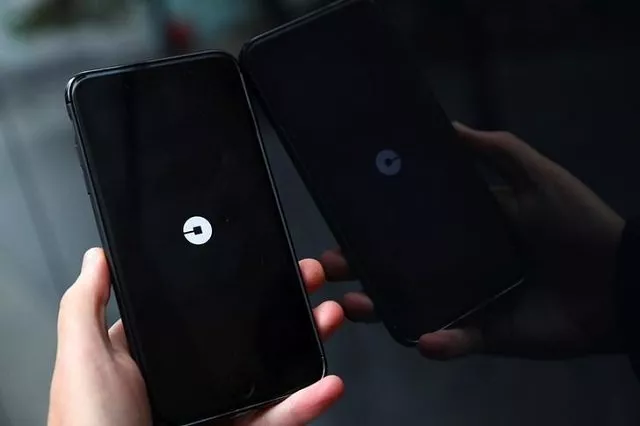 the uber logo is seen on mobile telephone in london britain september 25 2017 photo reuters the uber logo is seen on mobile telephone in london britain september 25 2017 photo reuters