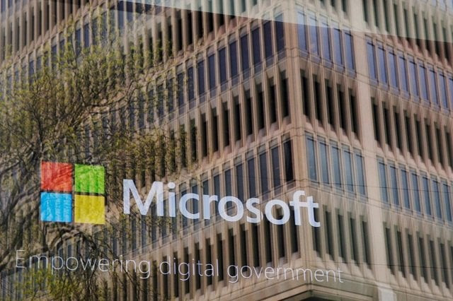 an promotional video plays behind a window reflecting a nearby building at the microsoft office in cambridge massachusetts us on may 15 2017 photo reuters an promotional video plays behind a window reflecting a nearby building at the microsoft office in cambridge massachusetts us on may 15 2017 photo reuters