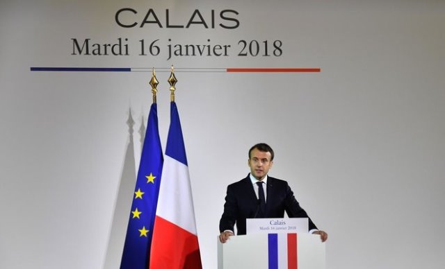 french president emmanuel macron delivers a speech to police officers and gendarmes in the gendarmerie headquarters in calais northern france january 16 2018 photo afp