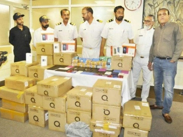 customs officials with the seized phones photo express file customs officials with the seized phones photo express file