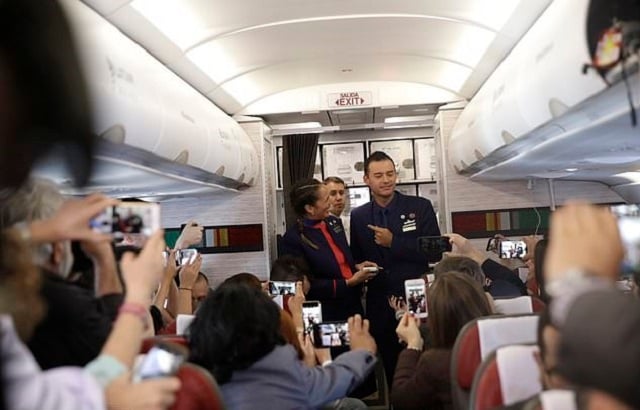 flight attendants carlos ciuffardi right and paola podest left talk with journalists during a flight from santiago chile to iquique chile after pope francis married them in flight early thursday jan 18 2018 photo ap