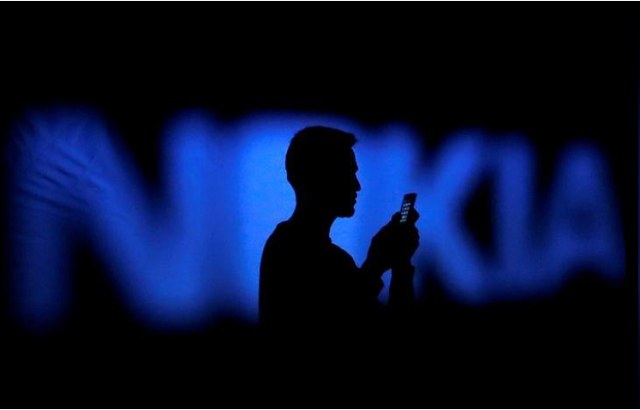 a photo illustration of a man silhouetted against a nokia logo in the central bosnian town of zenica january 23 2014 photo reuters a photo illustration of a man silhouetted against a nokia logo in the central bosnian town of zenica january 23 2014 photo reuters