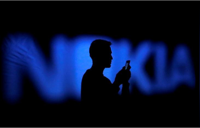 a photo illustration of a man silhouetted against a nokia logo in the central bosnian town of zenica january 23 2014 photo reuters