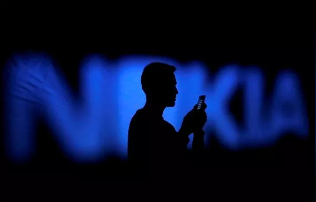 a photo illustration of a man silhouetted against a nokia logo in the central bosnian town of zenica january 23 2014 photo reuters a photo illustration of a man silhouetted against a nokia logo in the central bosnian town of zenica january 23 2014 photo reuters