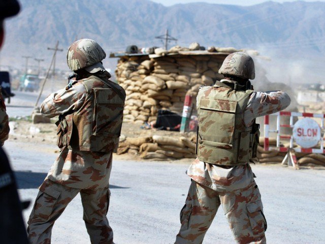 frontier corps fc troops fire toward the alleged attackers next to a security checkpoint in quetta on may 18 2011 photo afp
