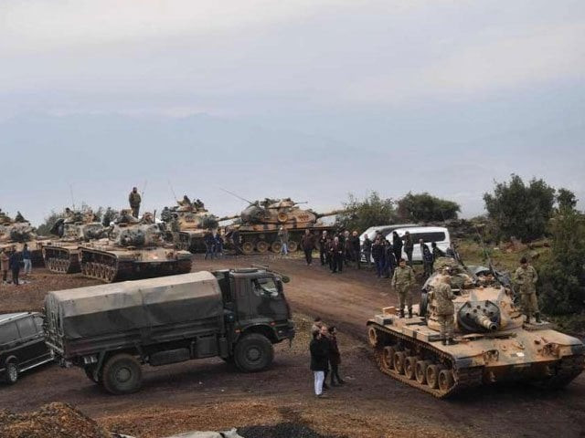 villagers watch as turkish army tanks and soldiers gather near the syrian border on january 21 2018 at hassa in hatay province photo afp villagers watch as turkish army tanks and soldiers gather near the syrian border on january 21 2018 at hassa in hatay province photo afp