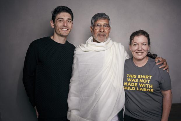 director derek doneen kailash satyarthi and producer sarah anthony pose for a portrait to promote the film kailash at the music lodge during the sundance film festival on friday photo afp