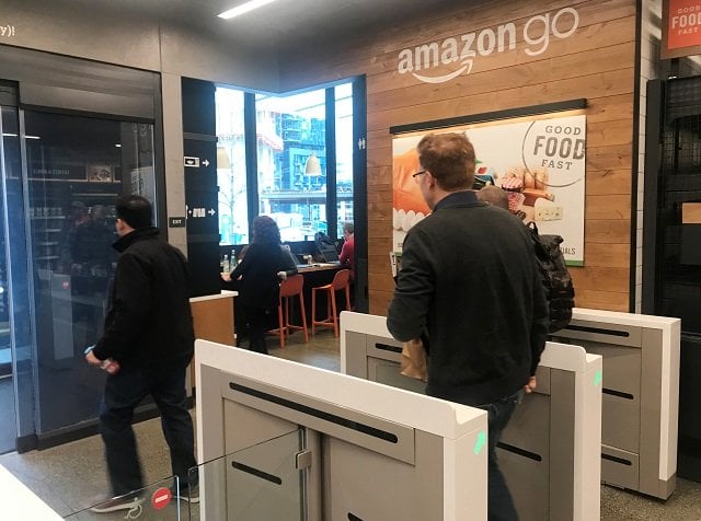 a customer walks out of the amazon go store without needing to pay at a cash register due to cameras sensors and other technology that track goods that shoppers remove from shelves and bill them automatically after they leave in seattle washington us january 18 2018 photo reuters