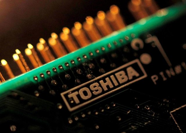 a logo of toshiba is seen on a printed circuit board in this photo illustration taken in tokyo july 31 2012 photo reuters