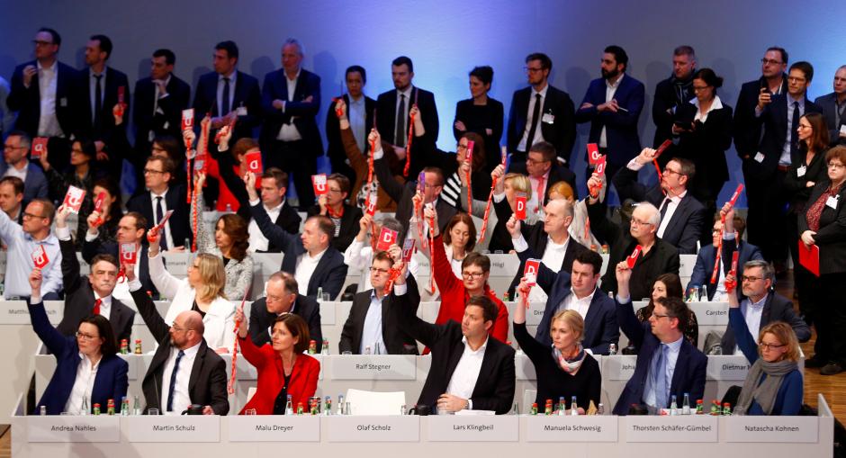 merkel readies for intense german coalition talks after tight spd vote