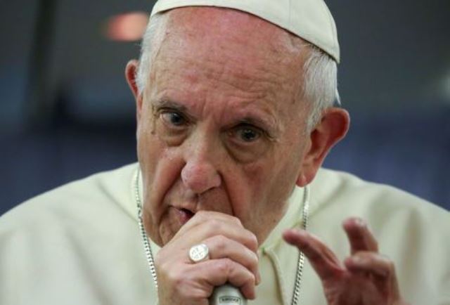 pope francis gestures during a news conference on board of the plane during his flight back from a trip to chile and peru january 22 2018 photo afp