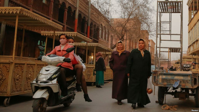 people was a long a shopping street in the old town of kashgar in china photo reuters