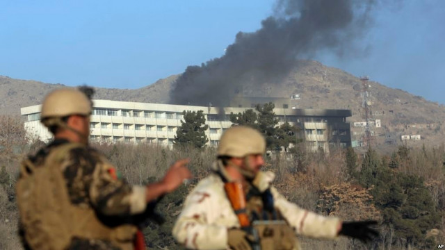 afghan security personnel stand guard as smoke rises from the intercontinental hotel after an attack in kabul photo afp afghan security personnel stand guard as smoke rises from the intercontinental hotel after an attack in kabul photo afp