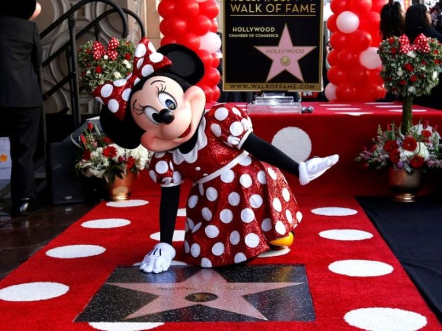 the character of minnie mouse poses on her star after it was unveiled on the hollywood walk of fame in los angeles california u s january 22 2018 reuters mario anzuoni