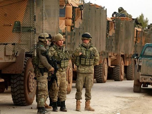 turkish soldiers are seen around the area of mount bersaya north of the syrian town of azaz near the border with turkey photo afp