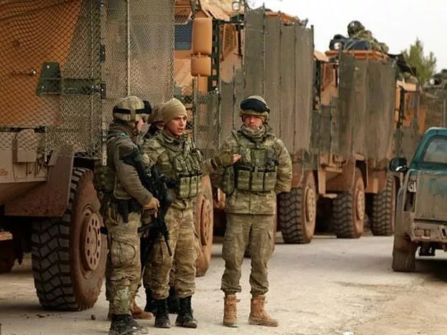 turkish soldiers are seen around the area of mount bersaya north of the syrian town of azaz near the border with turkey photo afp turkish soldiers are seen around the area of mount bersaya north of the syrian town of azaz near the border with turkey photo afp