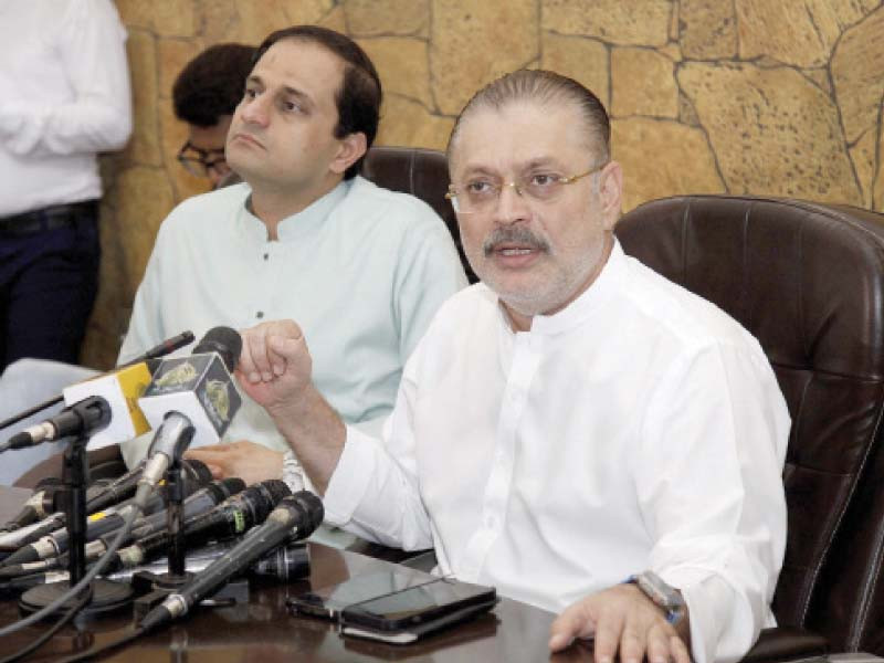 sharjeel inam memon accompanied by murtaza wahab speaks during a press conference on tuesday photo express