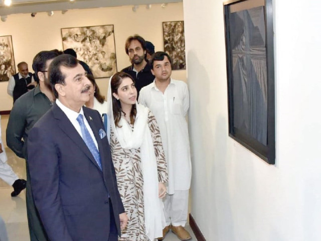 senate chairman syed yousaf raza gilani along with other officials views paintings on display at a fundraiser exhibition inaugurated at the pnca photo express senate chairman syed yousaf raza gilani along with other officials views paintings on display at a fundraiser exhibition inaugurated at the pnca photo express