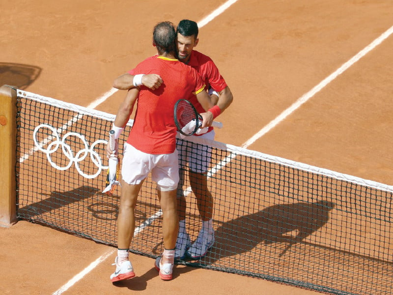 novak djokovic of serbia and rafael nadal of spain hug after their olympics clash on monday photo reuters