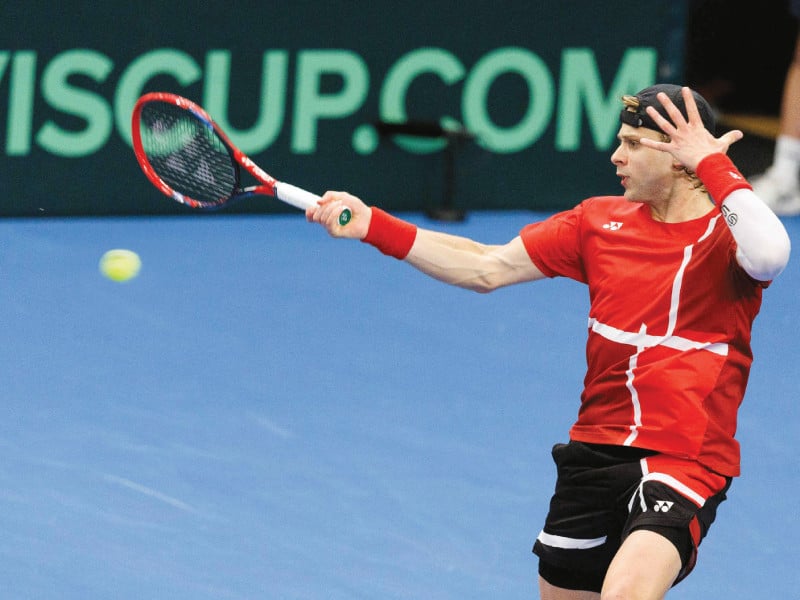 belgium s zizou bergs hits a return to chile s cristian garins during their singles match in davis cup qualifiers world group in hasselt on monday photo afp