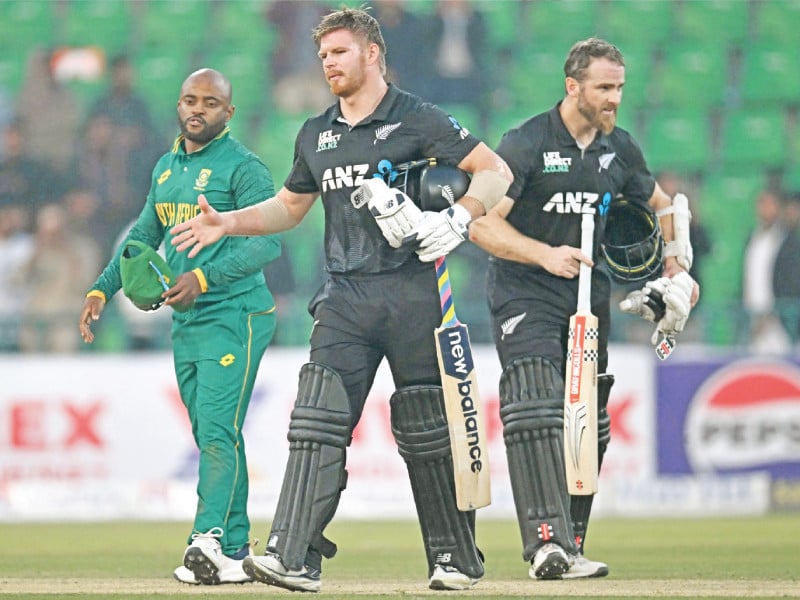 south africa s captain temba bavuma l looks on as new zealand s kane williamson r and glenn phillips c walk back to the pavilion after winning the tri nation series odi at the gaddafi stadium in lahore photo afp