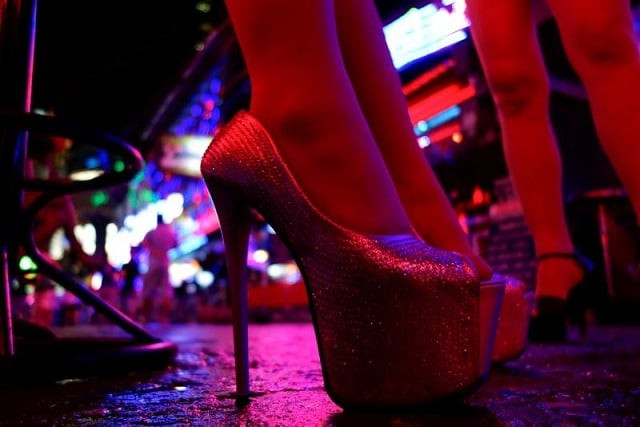 women stand outside a bar in a red light district in bangkok thailand july 12 2016 photo reuters women stand outside a bar in a red light district in bangkok thailand july 12 2016 photo reuters