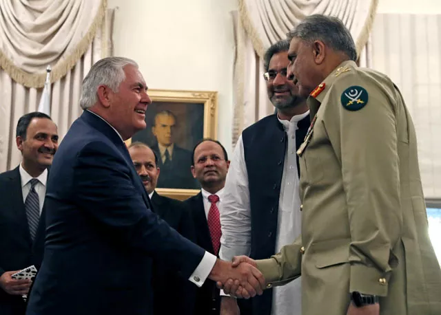 secretary of state rex tillerson shakes hands with pakistan s chief of army staff qamar javed bajwa next to pakistani prime minister shahid khaqan abbasi in islamabad in october photo afp secretary of state rex tillerson shakes hands with pakistan s chief of army staff qamar javed bajwa next to pakistani prime minister shahid khaqan abbasi in islamabad in october photo afp