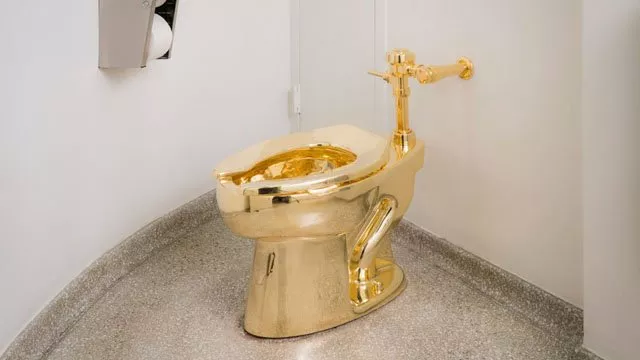 the exhibit by maurizio cattelan is titled 039 america 039 and is seen as a satire on the excessive wealth in the us photo guggenheim the exhibit by maurizio cattelan is titled 039 america 039 and is seen as a satire on the excessive wealth in the us photo guggenheim