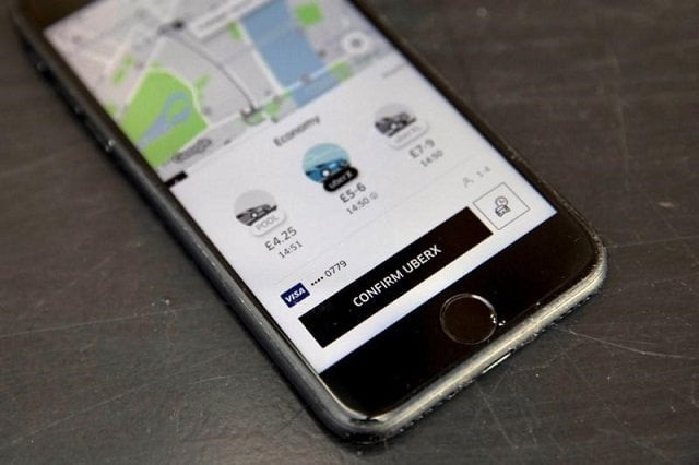 a photo illustration shows the uber app on a mobile telephone as it is held up for a posed photograph in london britain november 10 2017 photo reuters a photo illustration shows the uber app on a mobile telephone as it is held up for a posed photograph in london britain november 10 2017 photo reuters