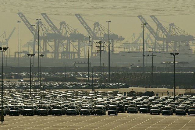 this file photo taken on december 17 2003 shows smog enveloping cranes and newly imported cars in the shipyards of the port of long beach in los angeles california photo afp