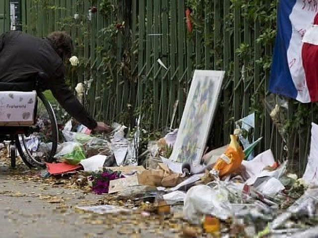 a man in a wheelchair pays tribute to the victims of the november 13 terror attacks at a makeshift memorial near the bataclan concert hall in paris on december 10 2015 photo afp file a man in a wheelchair pays tribute to the victims of the november 13 terror attacks at a makeshift memorial near the bataclan concert hall in paris on december 10 2015 photo afp file