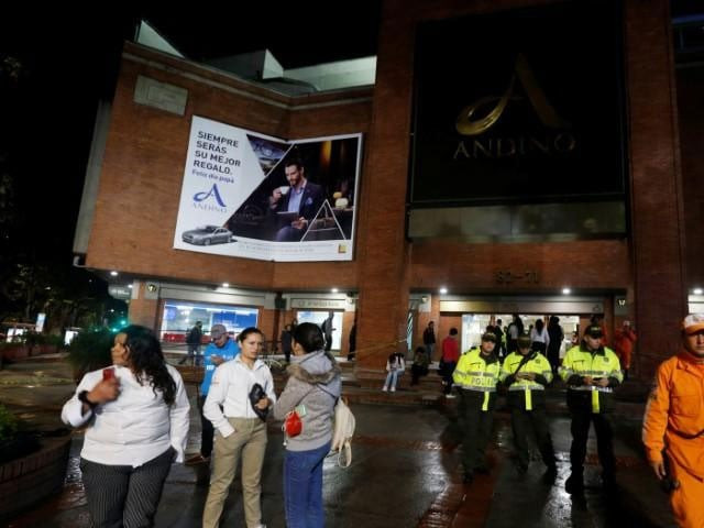 people police officers and rescue personnel stand outside the andino shopping center after an explosive device detonated in a restroom in bogota colombia june 17 2017 photo reuters