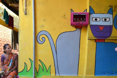 colourful makeover puts mumbai slum on tourist map