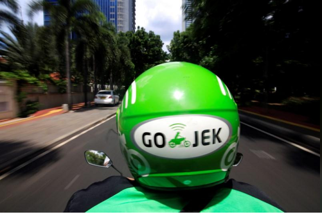 a go jek driver rides a motorcycle on a street in jakarta indonesia december 15 2017 photo reuters