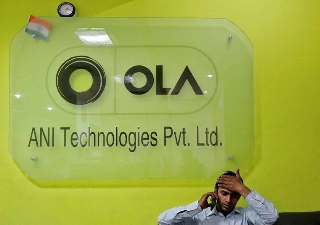 an employee speaks over his phone as he sits at the front desk inside the office of ola cab service in gurugram previously known as gurgaon on the outskirts of new delhi india april 20 2016 photo reuters an employee speaks over his phone as he sits at the front desk inside the office of ola cab service in gurugram previously known as gurgaon on the outskirts of new delhi india april 20 2016 photo reuters