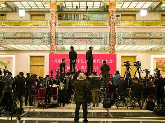 journalists at a press conference before the opening of the communist party congress last october photo afp file