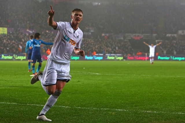 swansea city 039 s english midfielder sam clucas celebrates scoring their first goal during the english premier league football match between swansea city and arsenal at the liberty stadium in swansea south wales on january 30 2018 photo afp swansea city 039 s english midfielder sam clucas celebrates scoring their first goal during the english premier league football match between swansea city and arsenal at the liberty stadium in swansea south wales on january 30 2018 photo afp