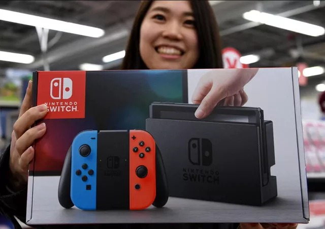 31 year old nao imoto posing with her newly purchased nintendo switch game console at a shop in tokyo nintendo nearly doubled its full year profit forecast as it pointed to sizzling sales of its switch games console and a cheaper yen for the upbeat outlook photo afp 31 year old nao imoto posing with her newly purchased nintendo switch game console at a shop in tokyo nintendo nearly doubled its full year profit forecast as it pointed to sizzling sales of its switch games console and a cheaper yen for the upbeat outlook photo afp
