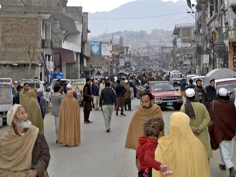 people rush out of their homes and shops as tremors jolt the city in lower dir photo inp