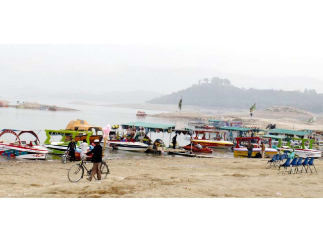 a view of almost dried up khanpur dam lake photo express