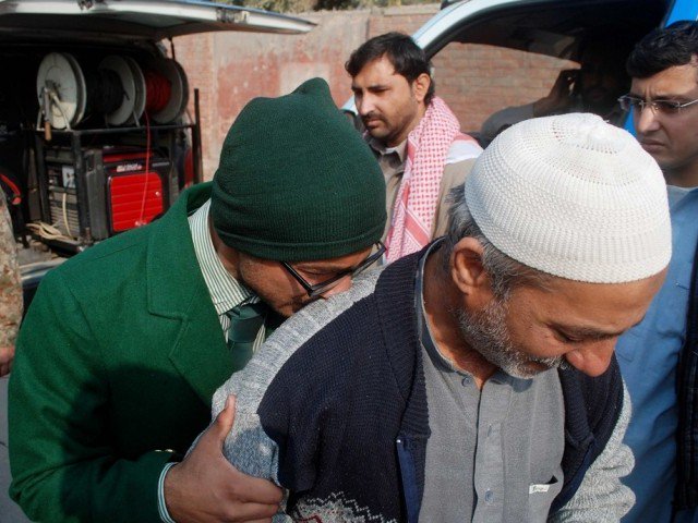 a student cries on a man 039 s shoulder after he was rescued from the army public school that was attacked by taliban gunmen in peshawar december 16 2014 photo reuters file