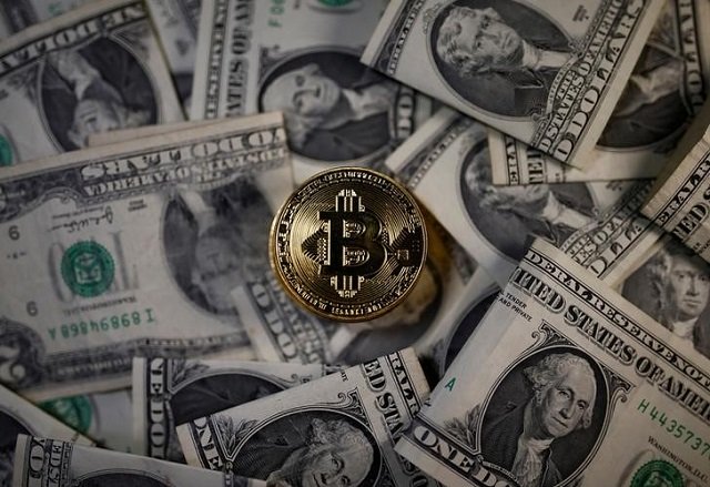 a bitcoin virtual currency coin placed on dollar banknotes is seen in this illustration picture november 6 2017 photo reuters